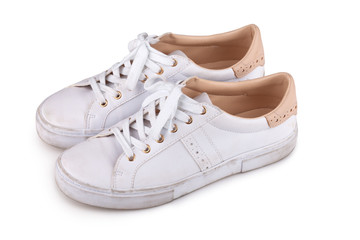 Dirty sneakers isolated on white