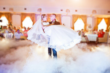 Amazing first wedding dance with fog smoke at dancefloor and various lights.