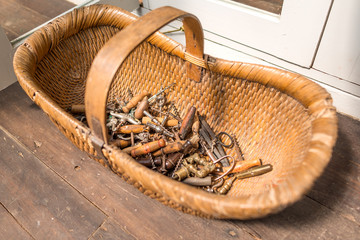 The old wine bottle opener corkscrew in the rattan basket