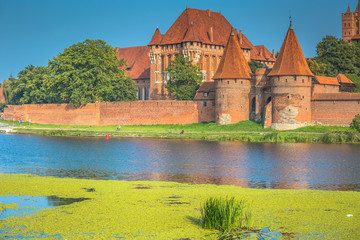 Naklejka na ściany i meble Malbork Castle at Nogat River in Poland, Europe
