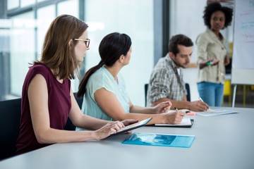 Fototapeta premium Business executive using digital tablet in meeting