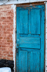 Brick wall and old wooden door