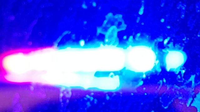 Police Siren Lights Closeup Seen Through A Dirty Window