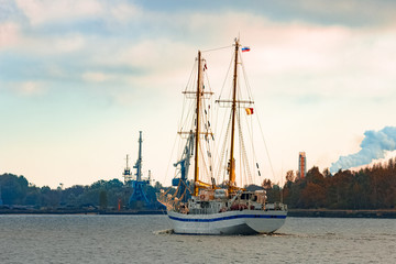 Fototapeta premium White sailing ship coming from Baltic sea and entering Riga