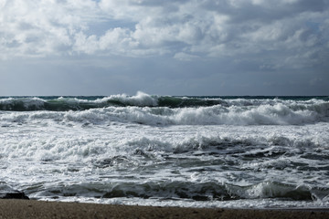 powerful waves shot on cloudy day