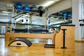 Various gym equipment's on wooden floor