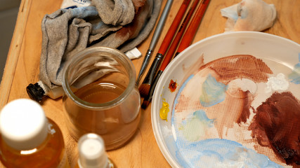 Graphic artist tools: oils color paints palette with paintbrushes