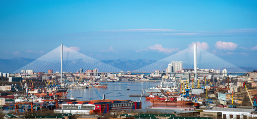 Panorama of the city of Vladivostok. View of the Golden Horn Bay and the Golden Bridge