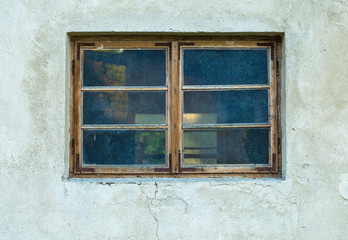 Old abandoned window, detail of a window of a house