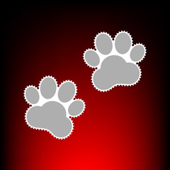 Animal Tracks sign. Postage stamp or old photo style on red-black gradient background.