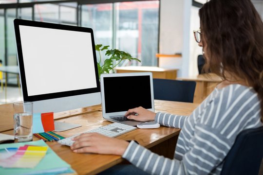 Female graphic designer working at desk