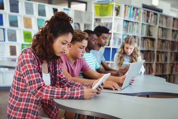Students using laptop, digital tablet