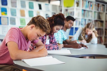 Attentive students studying in library