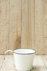 bucket of water on wood background, vintage filtered Images