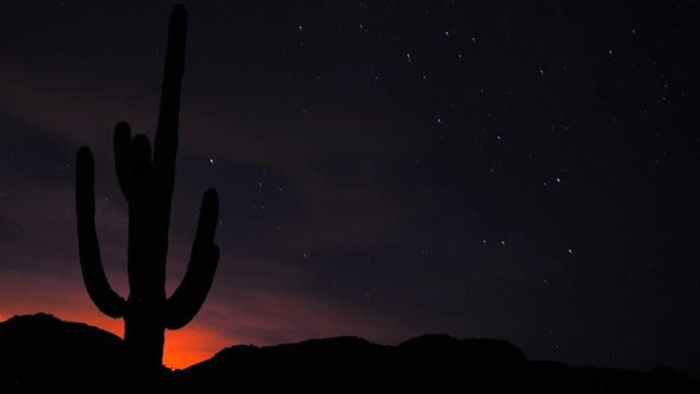 A time-lapse of the stars above the Harquahala Mountains in Arizona, USA. Sunset immediately followed by star lapse movement in space. Beautiful and artistic. Moon.