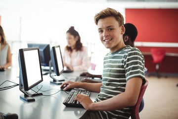 Fototapeta na wymiar Student using computer in classroom