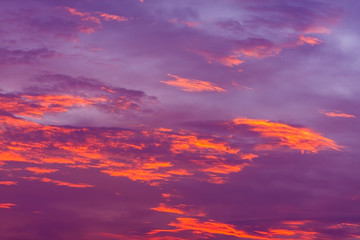 Naklejka na ściany i meble Nature background. Red sky at night and clouds. Beautiful and colorful sunset time.