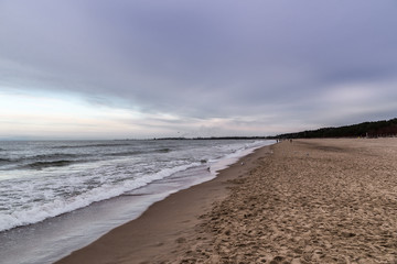 Waves on beach in sunset time. Baltic sea, Gdansk.