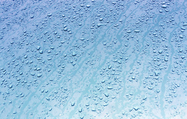 Water drops on metal surface with blur effect.