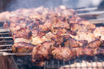Grilling skewers or shashlik on barbecue grill. Selective focus