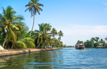 Kollam, India 2017: Fishing boat on the river near Kollam on Kerala backwaters, India