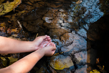 Hand on water shortage close up. Concept drought.