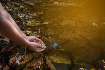 Hand on water shortage close up. Concept drought.