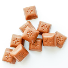 chocolate pieces on a white background