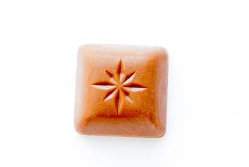 Chocolate pieces on a white background