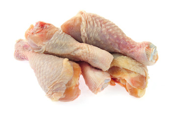 Raw chicken leg on a white background