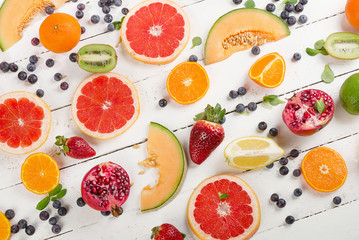 Fresh mixed fruits on a wooden table. Healthy  diet eating concept. Pattern.