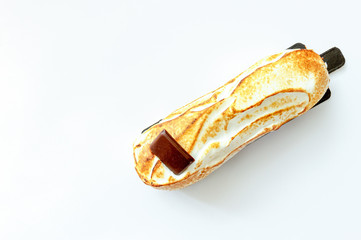 Scalded cake with chocolate on a white background