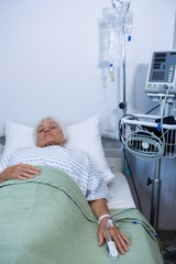 Senior patient lying on bed 