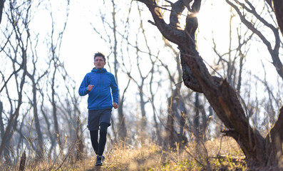 Early morning run in the park on a chilly day
