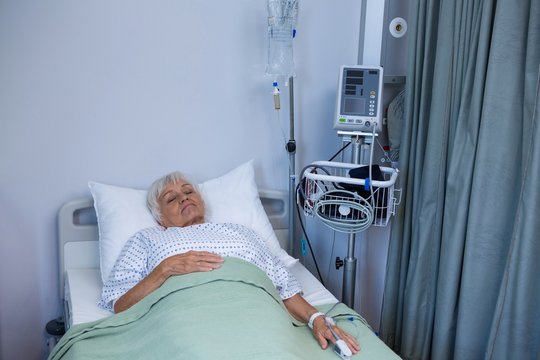 Senior patient lying on bed 