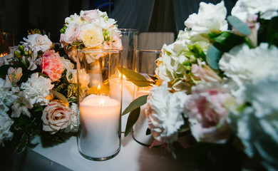 Wedding decoration on the table of flowers and candles