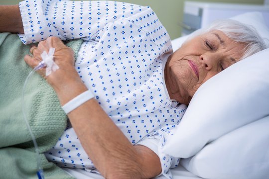 Senior patient lying on bed