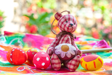 easter egg with bear on colorful paper