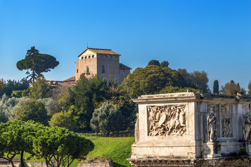 Rome, Italy. The upper part of the triumphal arch of Constantine (315 AD) against the backdrop of the Palatine Hill and the Church of San Bonaventura