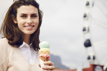 Beautiful brunette with ice cream treat, portrait