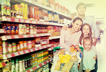 Family with two daughters shopping