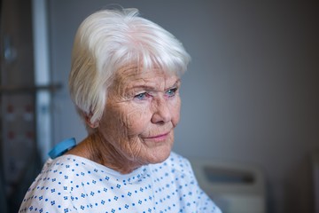 Senior patient standing at hospital