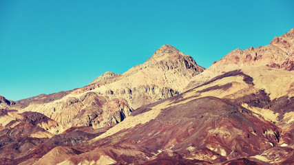 Color toned photo of a mountain range in Death Valley National Park, California, USA.