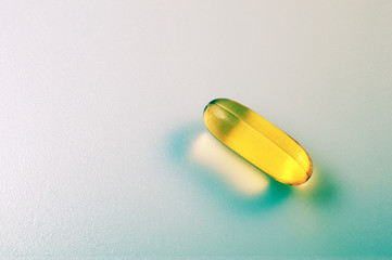 Fish oil capsule isolated on white.