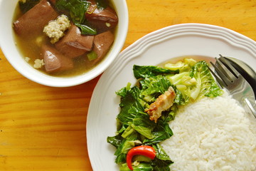 stir fried Chinese kale sprout and pork blood soup