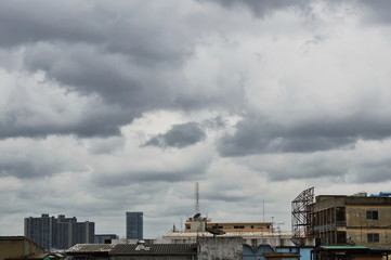 Fototapeta na wymiar rain cloud covering building in the city