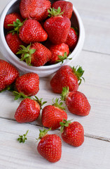 fresh sweet strawberry in the bowl on wooden background 