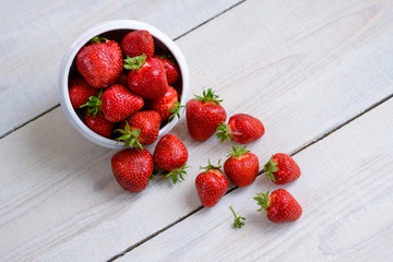 fresh sweet strawberry in the bowl on wooden background 