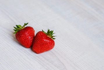 fresh sweet strawberry in the bowl on wooden background 