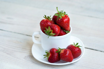 fresh sweet strawberry in the bowl on wooden background 
